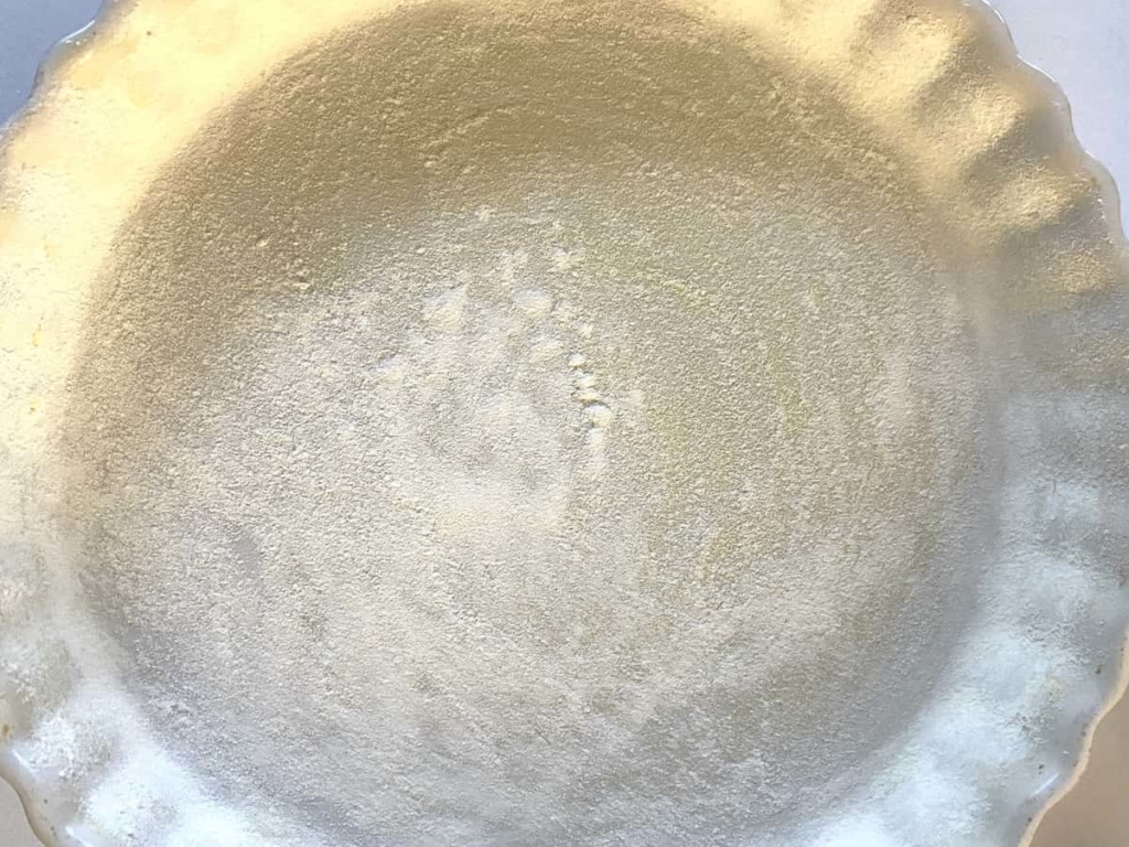 cake pan with flour and butter